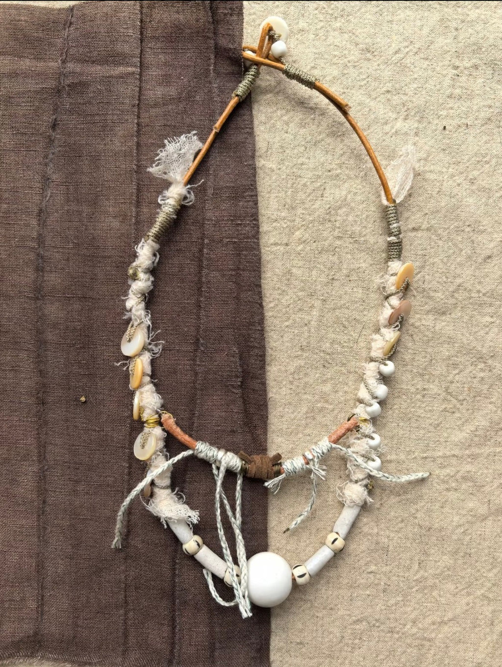 Tidal Relic one-of-a-kind necklace made from twig, shell fragments, wrapped textile, cord, and beads