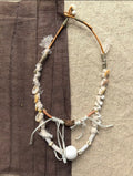 Tidal Relic one-of-a-kind necklace made from twig, shell fragments, wrapped textile, cord, and beads