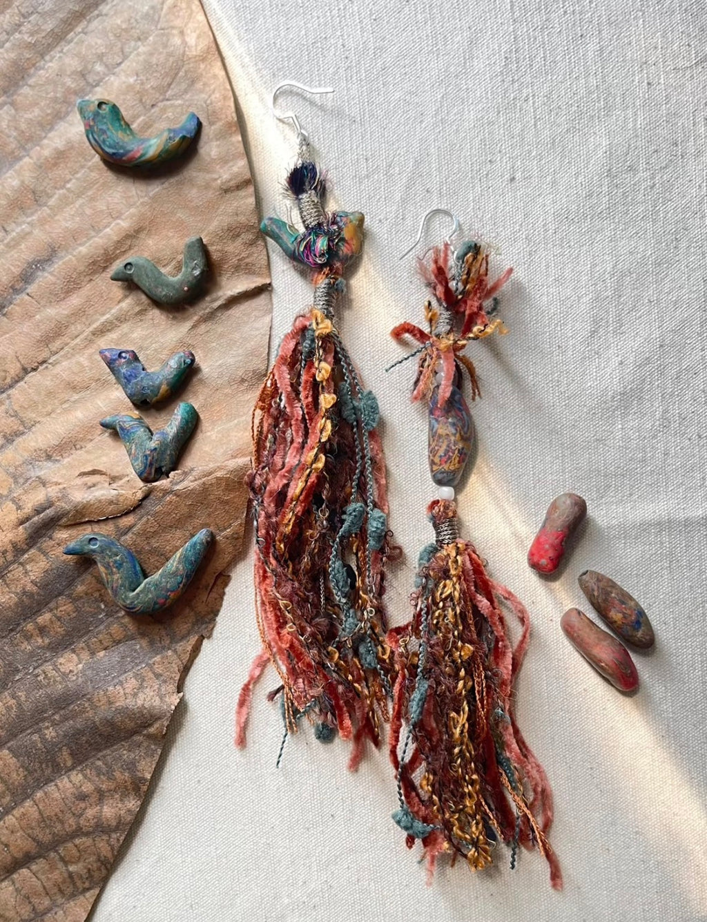 Handmade bird-shaped elements used for made-to-order tassel earrings.
