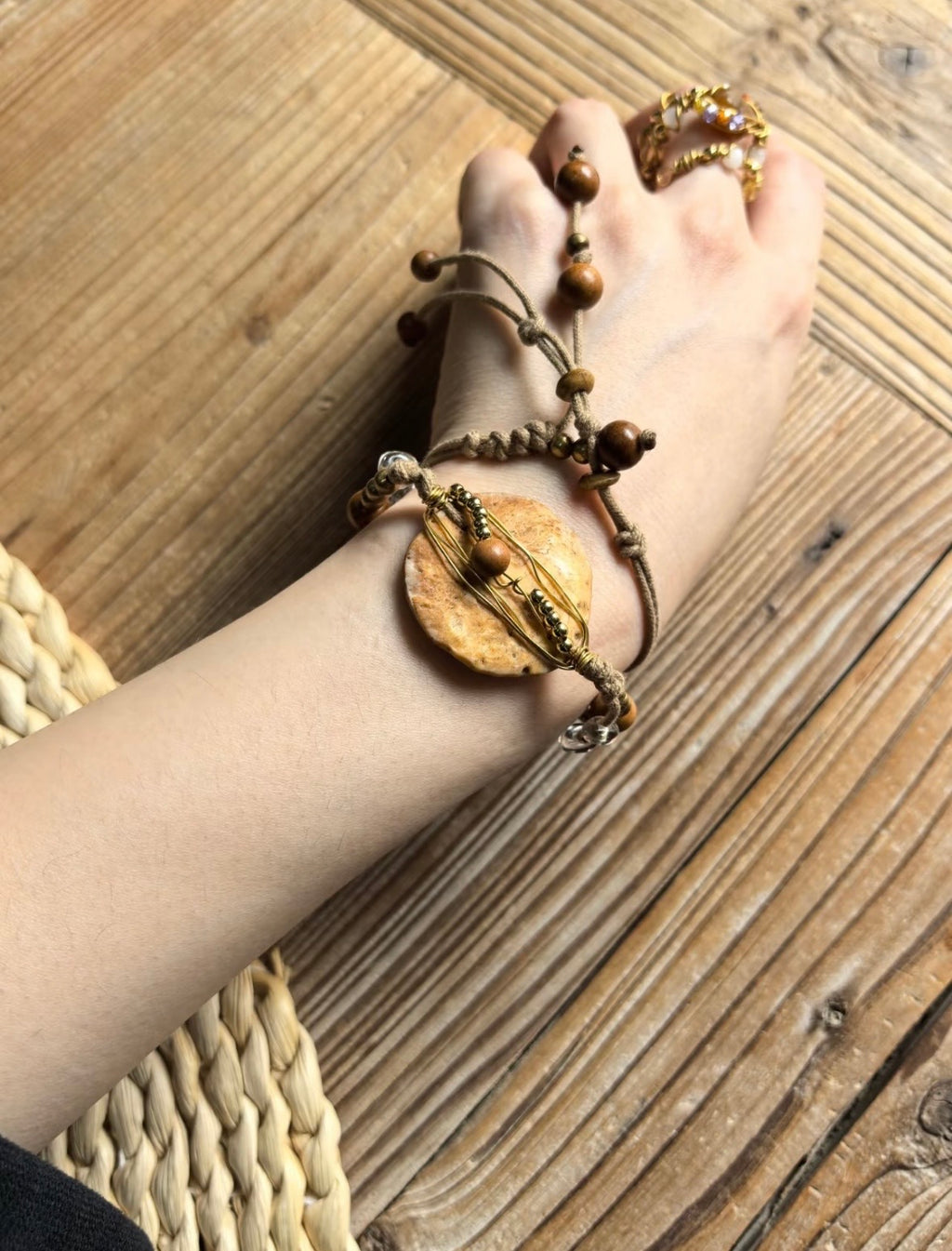 Handmade nummulite fossil convertible necklace bracelet with brass wire, wood beads, and brass bead details