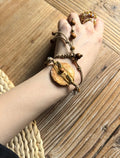 Handmade nummulite fossil convertible necklace bracelet with brass wire, wood beads, and brass bead details