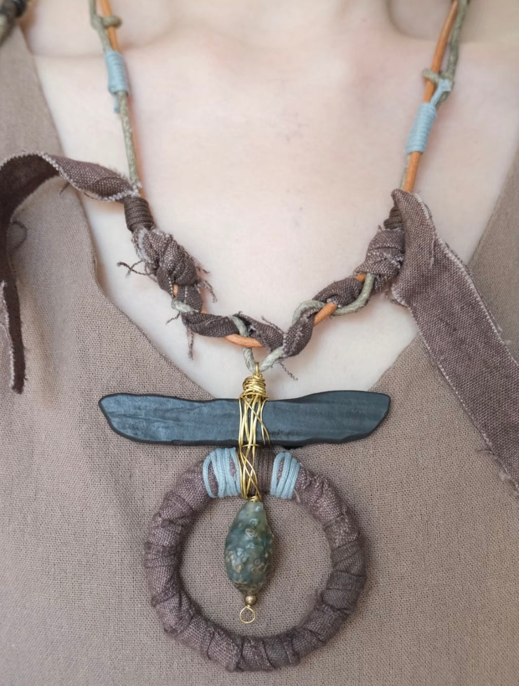 One-of-a-kind handmade boho statement necklace with earthy tones, wrapped textile details, and artisan pendant design