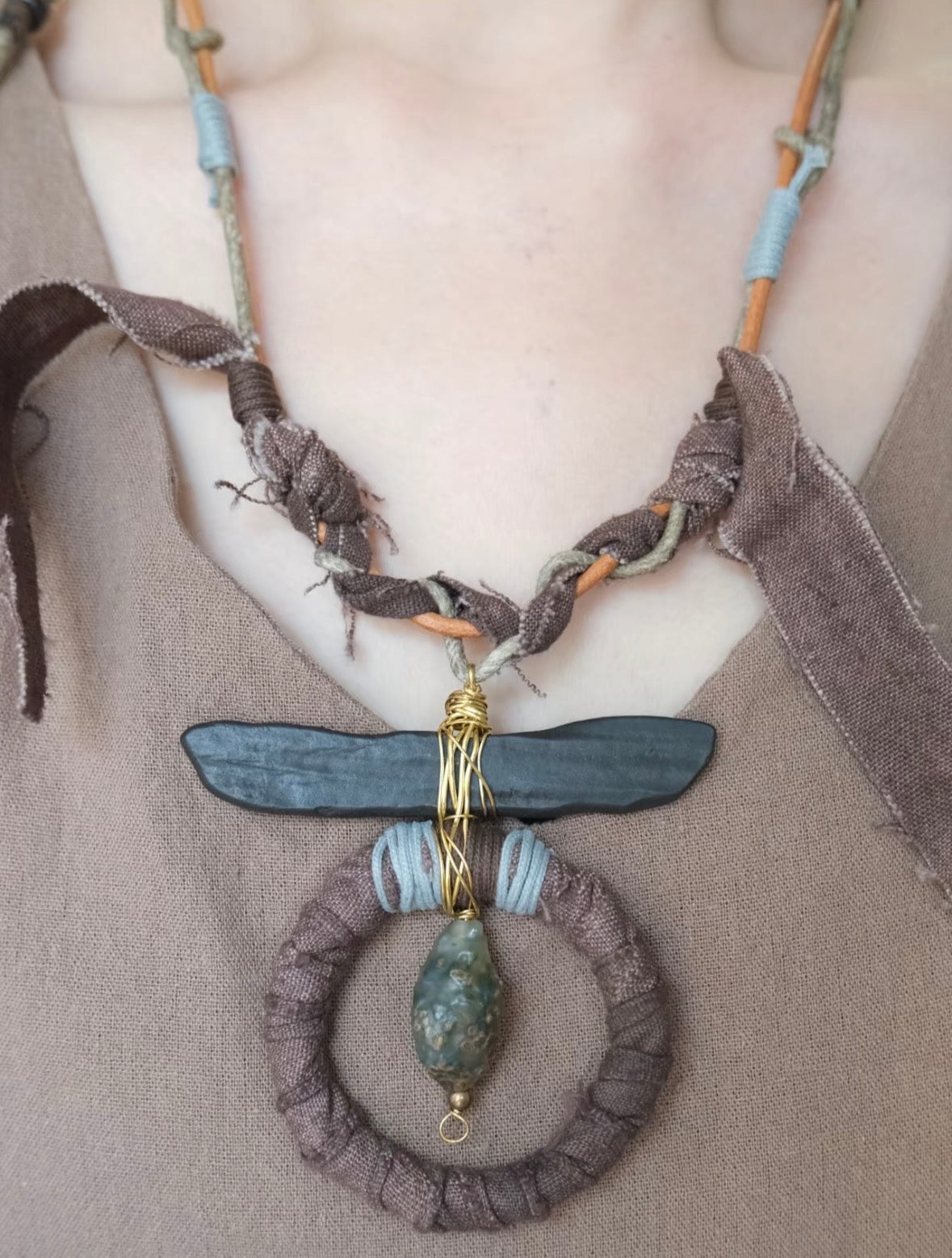 One-of-a-kind handmade boho statement necklace with earthy tones, wrapped textile details, and artisan pendant design